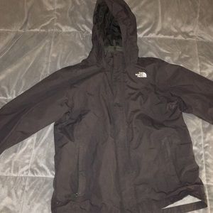 A The North Face wind breaker it’s in boys size XL